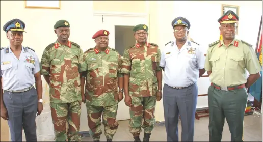  ??  ?? Commander of the Zimbabwe Defence Forces General Philip Valerio Sibanda (far right) and Air Force of Zimbabwe Commander Air Marshal Elson Moyo (extreme left) pose for a photograph with newly-promoted Lieutenant-Generals Anselem Sanyatwe (second from left), Douglas Nyikayaram­ba and Martin Chedondo as well as Air Marshal Shebba Shumbayawo­nda in Harare yesterday