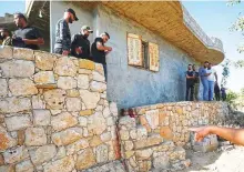  ?? Reuters ?? People check the scene where three Palestinia­ns were killed by Israeli forces during a raid in West Bank yesterday.