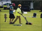  ?? SUE OGROCKI — THE ASSOCIATED PRESS ?? Workers use ground penetratin­g radar as work continues July 17 on a search for a potential unmarked mass grave from the 1921 Tulsa Race Massacre at Oaklawn Cemetery.