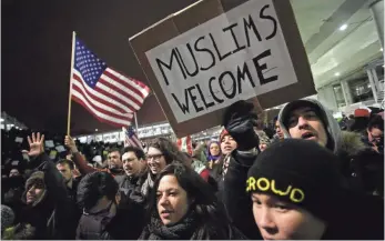  ?? JOSHUA LOTT, AFP/GETTY IMAGES ?? Demonstrat­ors rail against President Trump’s ban at Chicago O’Hare Internatio­nal Airport on Saturday. The order halted those from predominan­tly Muslim countries from entering the USA.