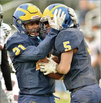  ?? KYLE FRANKO — TRENTONIAN PHOTO ?? Nottingham’s Marc Kauffman (5) is congratula­ted by Dionte Nicholson (21) after scoring a touchdown against Allentown last season. Both running backs return for the Northstars.