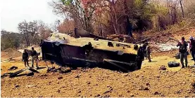  ?? — PTI ?? Security personnel inspect the site of an IED blast in Kistaram area of Chhattisga­rh’s Sukma district on Tuesday.