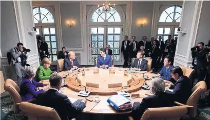  ?? SEAN KILPATRICK/THE ASSOCIATED PRESS ?? G7 leaders in their final news conference­s at the summit described trade talk between their countries as frank and direct.