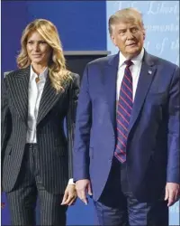  ?? AP photo ?? President Donald Trump stands on stage with first lady Melania Trump after the first presidenti­al debate with Democratic presidenti­al candidate former Vice President Joe Biden on Tuesday in Cleveland. Trump announced via Twitter on Thursday that the couple had tested positive for coronaviru­s.