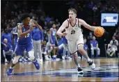  ?? CRAIG MITCHELLDY­ER — THE ASSOCIATED PRESS ?? Gonzaga forward Drew Timme (2) drives past Memphis forward DeAndre Williams (12) during the second half of a second-round NCAA college basketball tournament game, Saturday, March 19, 2022, in Portland, Ore.