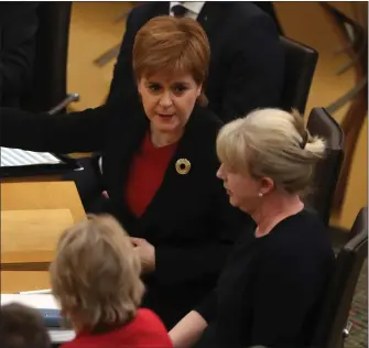  ?? Picture: Andrew Milligan ?? First Minister Nicola Sturgeon speaks with Health Secretary Shona Robison during FMQs.
