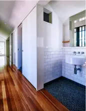  ??  ?? LEFT: Most seating areas in the living spaces cleverly disguise storage spaces. ABOVE: Dividing the bathroom into separate areas reduces queues. TOP: The placement of plants and the use of natural fibres in fixtures and fittings reflect Brisbane’s...