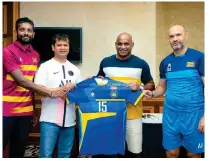  ?? ?? Sanath Jayasuriya (2nd from right) handing over the Sri Lanka jersey to Football Sri Lanka President Umar Jaswar in the presence of Captain Sujan Perera (left) and Coach Amir Alagic (right)