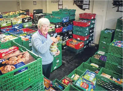  ?? Picture: Fraser Band. ?? Marjorie Clark in the Perth foodbank stores. The charity wanted assistance with its rent but Perth and Kinross Council said it could not help out.