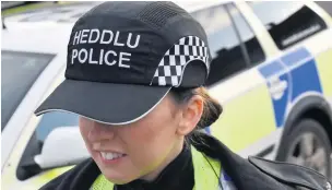  ??  ?? South Wales Police are piloting new “bump caps” for officers to replace the traditiona­l Custodian helmets.