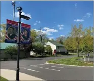  ?? SUBMITTED PHOTO COURTESY OF HATFIELD TOWNSHIP ?? “Hometown Hero” banners recognizin­g U.S. Navy Vietnam War veteran Robert Chellew and U.S. Army Cold War, Persian Gulf War and Desert Storm veteran Craig Wonsidler are seen near the entrance to the Hatfield Township municipal complex on School Road on Wednesday, May 13.
