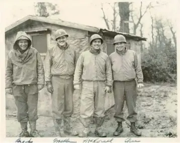  ?? LESLIE HOLLAND/COURTESY ?? Officers, from left, 1st Lt. Donald C. Brooks, Capt. John E. Mellen, 1st Lt. Robert B. McKorell and 2nd Lt. Maurice Green of the 818th Amphibious Truck company are pictured together at camp.