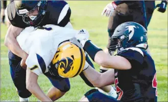  ?? FILE PHOTO/RON HARAMIA ?? Jamie Gierlowski makes the tackle against SB Riley last year. The senior is one of the key returnees to the Falcons this year.