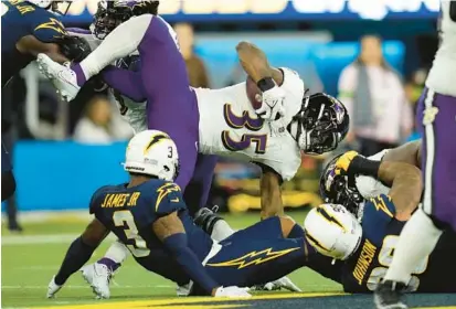  ?? ASHLEY LANDIS/AP ?? Ravens running back Gus Edwards said the bye week came at a perfect time.“You get a chance to get your legs back under you, work on the little nicks that you have, spend time with family. It started feeling like [the season] was dragging,” he said.