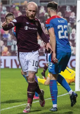  ??  ?? Hearts’ Liam Boyce celebrates after scoring to make it 2- 0 against Inverness at Tynecastle