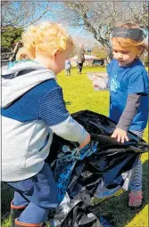  ?? PHOTOS / SUPPLIED. ?? Children from Kiwikidz Educare Waihi collecting rubbish.