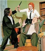  ?? [IMAGE PROVIDED] ?? Girleen (Katlyn Skaggs) breaks up a fight between Valene and Coleman (Rick Lockett, left, and Michael Relland) in “The Lonesome West” playing at Carpenter Square Theatre through June 2.