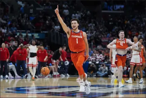  ?? RYAN SUN — THE ASSOCIATED PRESS ?? Clemson guard Chase Hunter celebrates after a win over Arizona in a Sweet 16game in the NCAA tournament on Thursday in Los Angeles.