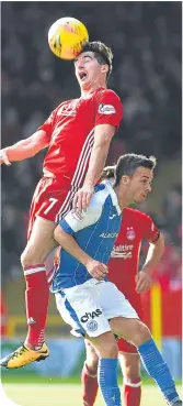  ??  ?? Aberdeen’s Kenny McLean easily outjumps Saint’s Stefan Scougall