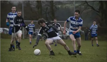  ??  ?? Kilbride/Lacken’s Philip Gallagher reaches the ball ahead of Blessingto­n’s Peter O’Connell.