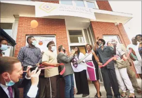  ?? Brian A. Pounds / Hearst Connecticu­t Media ?? Executive Director Monette Ferguson cuts the ribbon on a new neighborho­od office of Alliance for Community Empowermen­t, formerly ABCD, at 1376 Stratford Avenue in Bridgeport, on Wednesday.