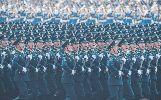  ?? ?? Troops march during a military parade in Beijing to mark the 70th anniversar­y of the founding of the People’s Republic of China. Picture: AFP