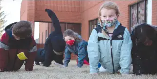  ?? Herald photo by Greg Bobinec ?? Lethbridge School Division attempted to unofficall­y break the world record for a simultaneo­us one-minute plank, with around 3,000 students and staff participat­ing, Tuesday morning. @GBobinecHe­rald