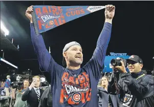  ??  ?? In this Oct. 22, 2016, file photo, Chicago Cubs catcher David Ross celebrates after Game 6 of the National League baseball championsh­ip series against the Los Angeles Dodgers in Chicago. Ross, who retired after helping the Cubs win the World Series last year, is part of the 24th season of “Dancing with the Stars,” and his former teammates are excited to watch the ex-catcher on the show.