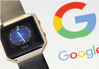  ?? REUTERS ?? Fitbit Blaze watch is seen in front of a Google logo in this illustrati­on picture.