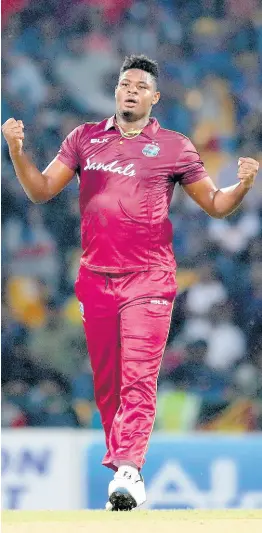  ?? AP ?? West Indies’ bowler Oshane Thomas celebrates the dismissal of Sri Lanka’s Dasun Shanaka during their first Twenty20 cricket match in Pallekele, Sri Lanka, yesterday. The West Indies won by 25 runs.