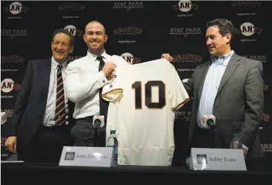  ?? Santiago Mejia / The Chronicle ?? From left: Giants CEO Larry Baer, third baseman Evan Longoria and general manager Bobby Evans at Friday’s news conference. Evans said finding an athletic center fielder remains the team’s top priority before camp.