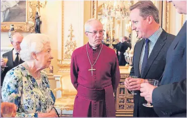  ?? Picture: AFP/GETTY ?? PARTY TALK: Her Majesty with the Archbishop of Canterbury and the Prime Minister