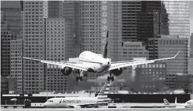  ?? MICHAEL DWYER/AP ?? A Delta Air Lines jet lands at Logan Internatio­nal Airport in Boston on Jan. 26.