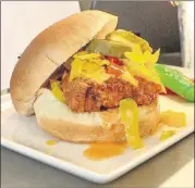  ??  ?? This hand-breaded free-range fried chicken sandwich, with Doux South chow chow and honey hot sauce, will be served at the West Nest in section 324 at Mercedes-Benz Stadium. The West Nest is operated by local nonprofit Westside Works, which creates...