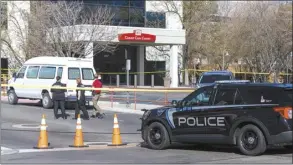  ?? Sarah A. Miller / Idaho Statesman photo via AP ?? A police vehicle is parked outside Saint Alphonsus Regional Medical Center in Boise, Idaho, on Wednesday. Three Idaho correction­s officers were shot as a suspect staged a brazen attack to break Skylar Meade, a prison inmate out of the Boise hospital overnight.