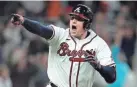  ?? AP ?? The Braves’ Austin Riley reacts after hitting the game-winning RBI single to score Ozzie Albies in the ninth inning on Saturday in Atlanta.