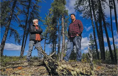  ?? Picture: AFP ?? PIONEERS. Ecologist and research scientist Louis de Grandpré, left, stands with indigenous Innu caribou researcher Jean-Luc Kanapé, right, in the Canadian boreal forest of the La Haute-Côte-Nord municipali­ty west of Baie-Comeau, Quebec.