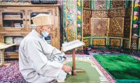  ??  ?? An elderly man reciting the holy Quran inside the 14th century shrine of Mir Syed Ali Hamadani in Khanqah-e-Moula locality of Old City on Wednesday. KO Photo, Abid Bhat