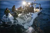  ?? U.S. NAVY VIA AP ?? Navy sailors assigned to Explosive Ordnance Disposal Group 2recover a high-altitude surveillan­ce balloon off the coast of Myrtle Beach, S.C., on Sunday.