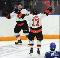  ?? NEWS PHOTO RYAN MCCRACKEN ?? Medicine Hat Tigers centre Elijah Brown celebrates a goal with Gary Haden during a Western Hockey League game against the Swift Current Broncos on Feb. 17.