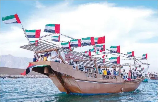  ?? ?? Residents enjoy a marine parade to ↑ mark the 51st UAE National Day on Thursday.