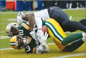  ?? Associated Press photo ?? Green Bay Packers cornerback Damarious Randall (23) intercepts a pass intended for New Orleans Saints wide receiver Brandon Coleman (16) during the first half of an NFL football game Sunday in Green Bay, Wis.