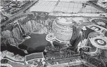  ?? FANG ZHE/AP ?? The Interconti­nental Shanghai Wonderland Hotel in Shanghai has been built into a hole in the ground left by a former pit mine.