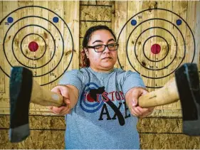  ?? Brett Coomer / Houston Chronicle ?? Sara Sed is owner of Houston Axe Throwing.