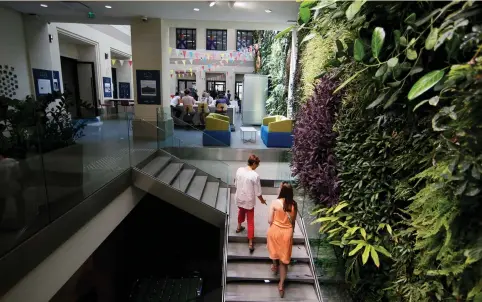  ?? (Gonzalo Fuentes/Reuters) ?? A WORK SPACE with a vertical garden is seen at Le Village by CA, a value-creating start-up incubator of banking group Credit Agricole, in Paris earlier this month. A recent Deloitte study ranked Paris 29th among global fintech hubs, and only seventh in...