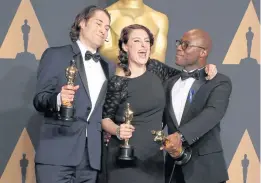  ?? Moonlight. ?? From left, Jeremy Kleiner, Adele Romanski and director Barry Jenkins hold the Oscar for Best Picture for