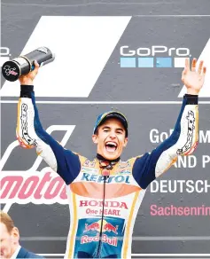  ??  ?? Spanish Honda rider Marc Marquez celebrates winning the MotoGP competitio­n of the Moto Grand Prix of Germany at the Sachsenrin­g Circuit on July 2, 2017 in Hohenstein­Ernstthal, eastern Germany. - AFP photo