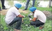  ?? HT PHOTO ?? Police officials during the search operation at Kangna village in SBS Nagar district on Thursday.