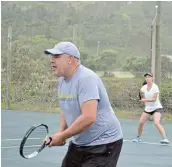  ?? ?? Adriaan Potgieter and Taryn Ford in action for the Pam Golding team, who came third overall in the Royal St Andrews Hotel Amanzi Challenge Tennis Cup