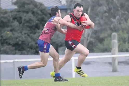  ??  ?? COME BACK HERE: Horsham’s Ryan Kemp applies a tackle to Stawell’s David Andrivon during Wimmera league action at Horsham City Oval. Pictures: PAUL CARRACHER